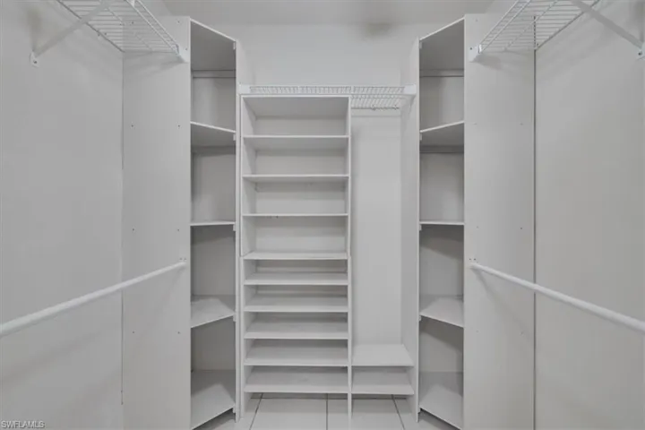 Walk in closet featuring light tile patterned floors