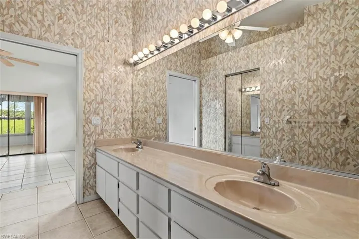 Bathroom featuring tile patterned flooring, vanity.