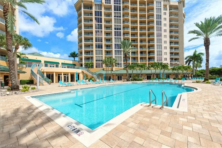 Community pool with a patio area