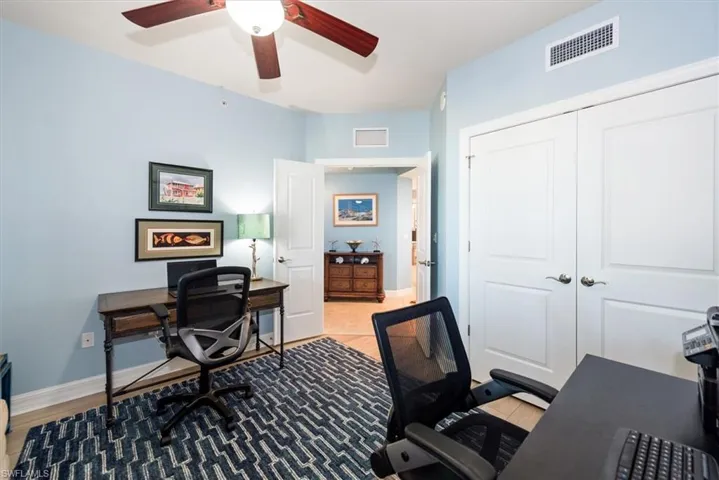 Office featuring light wood-type flooring and a ceiling fan