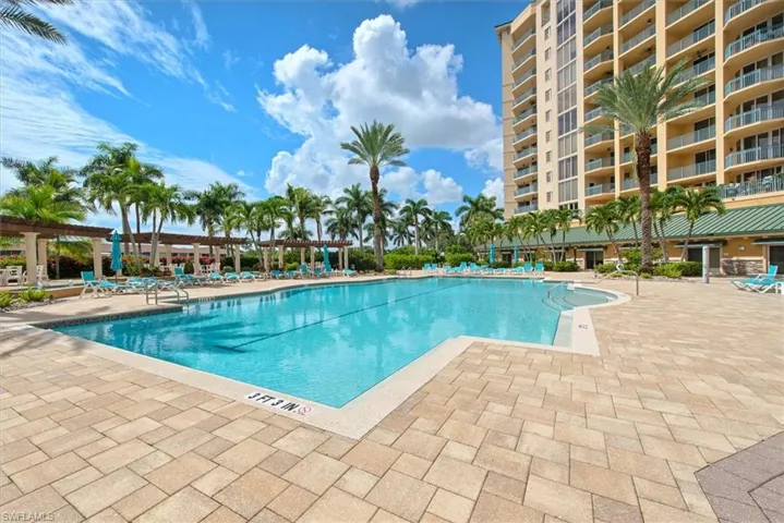 Community pool featuring a patio