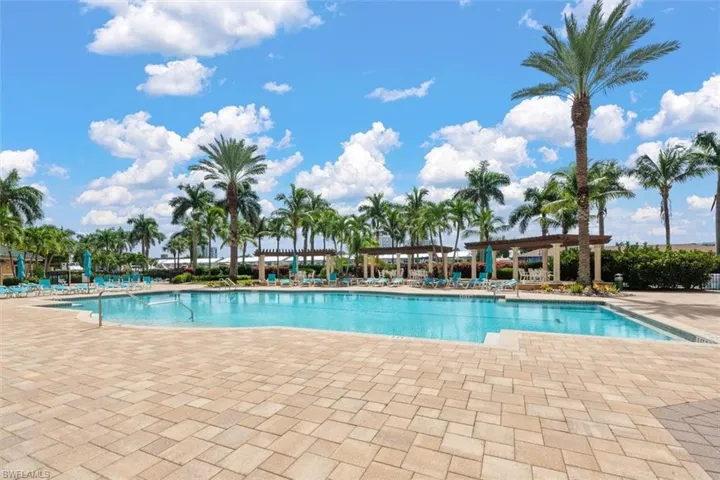Community pool with a patio area