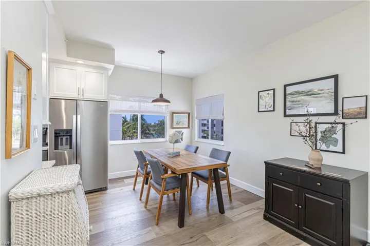 Dining area featuring light wood-type flooring and baseboards