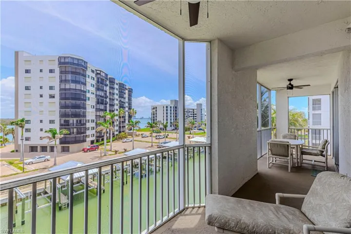 Balcony with a city view and ceiling fan