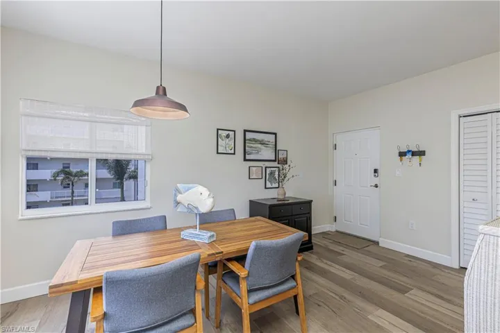 Dining area featuring wood finished floors and baseboards