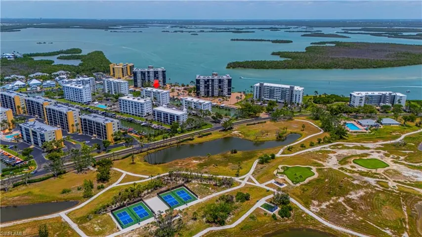 Birds eye view of property with a water view