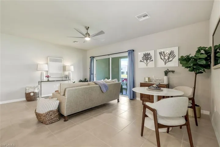 Updated lighting fixture, gorgeous neutral paint color and tiled floors throughout lower living area.