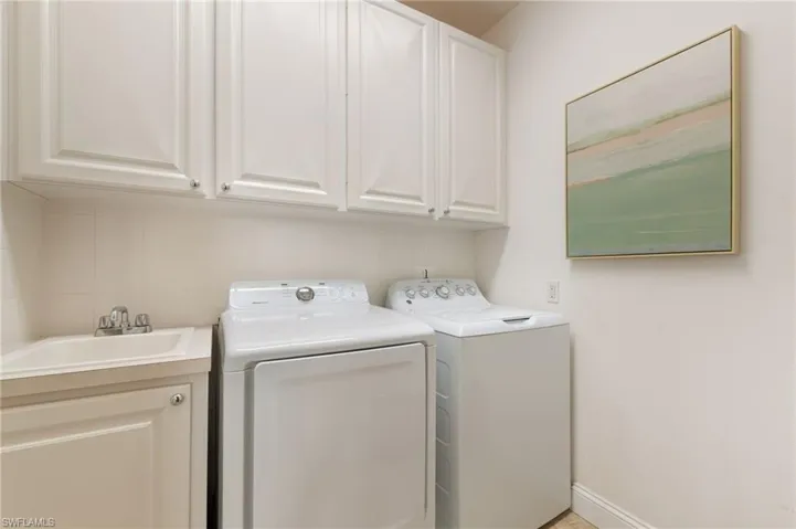 15594 Latitude Dr Bonita Springs FL 34135- Upstairs laundry room with utility sink