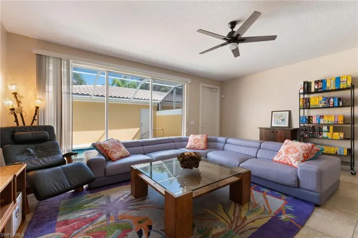 15594 Latitude Dr Bonita Springs FL 34135- living room adjacent to pool deck