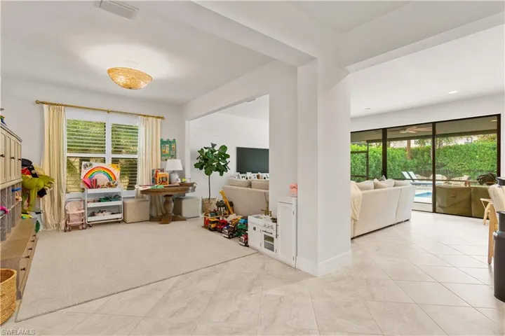 Playroom featuring light carpet and plenty of natural light