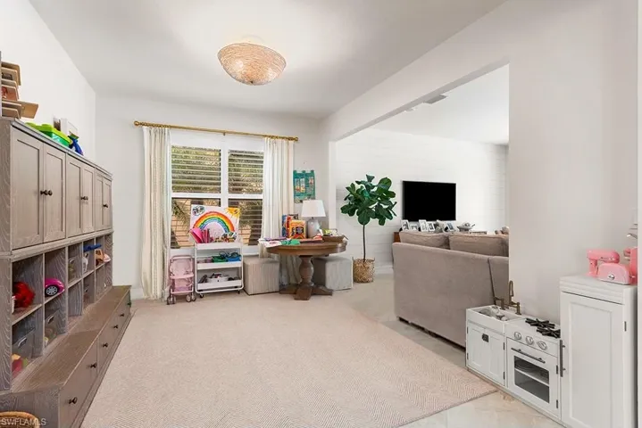 Rec room with light carpet