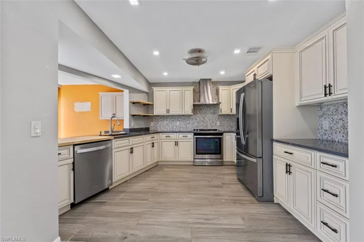 Completely renovate kitchen everything from cabinets and countertops to the backsplash