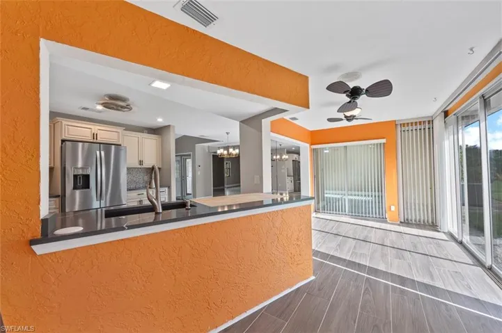 Bonus space. Previously a lanai are this area is now enclosed and under area with a great view of the backyard.