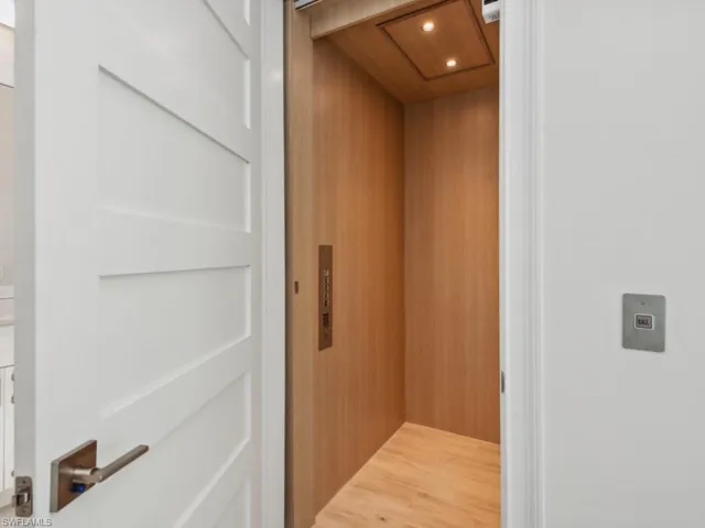 Interior details featuring elevator and wooden walls