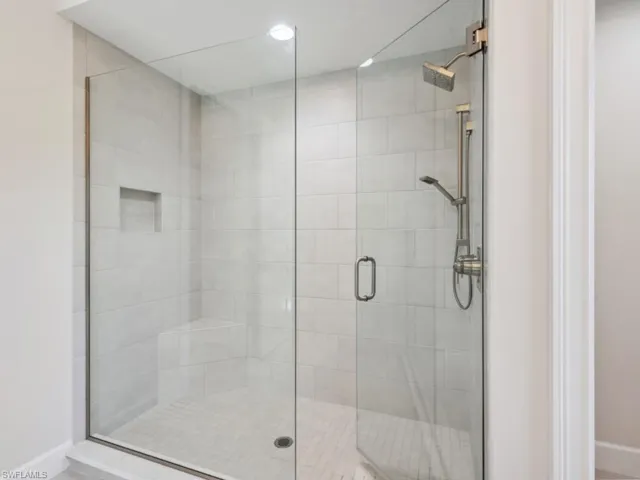 Bathroom featuring a shower with door