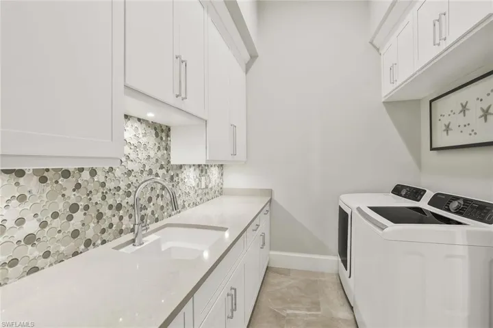Laundry area with washing machine and dryer and cabinet space