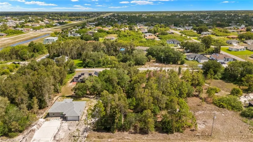 Aerial perspective of suburban area with a tree filled landscape
