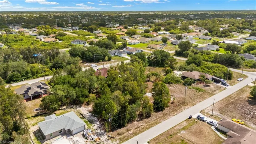 Aerial perspective of suburban area with a tree filled landscape