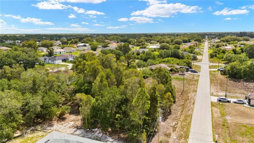 Aerial perspective of suburban area with a tree filled landscape