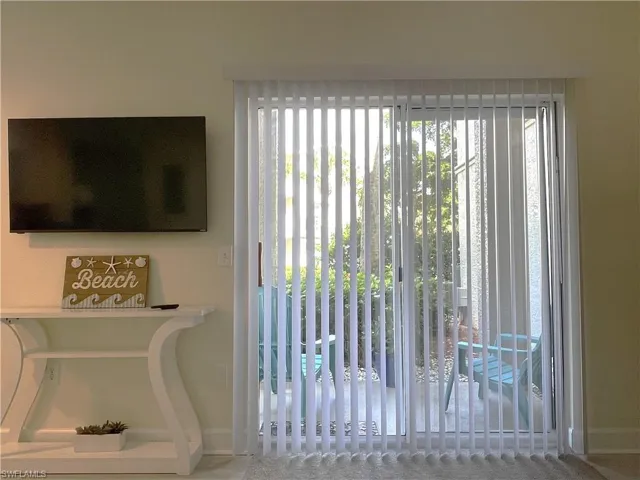 Open blinds looking at patio