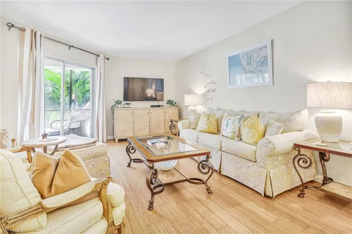 Living room with hardwood / wood-style flooring