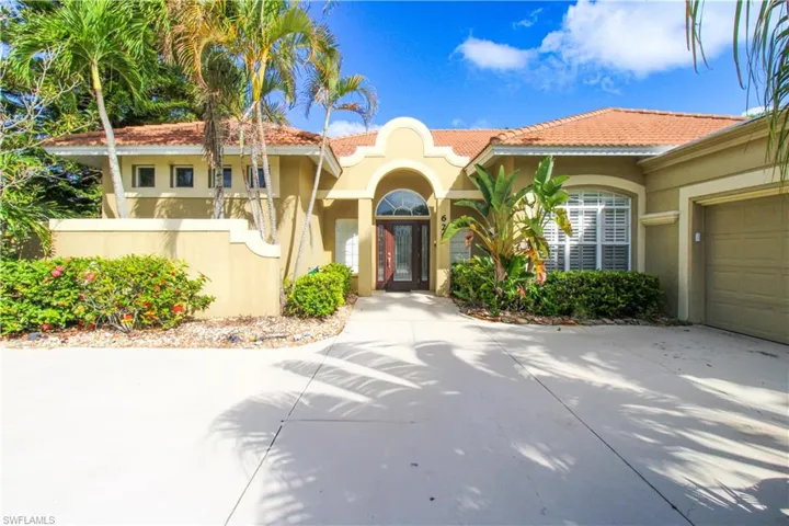 Mediterranean / spanish-style home featuring a garage