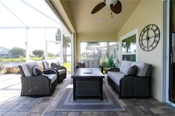 Sunroom featuring ceiling fan