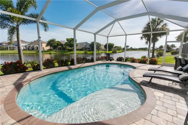 View of pool featuring a lanai and a patio