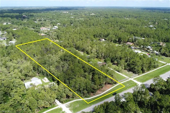 Aerial overview of property's location featuring a forest and property parcel outlined