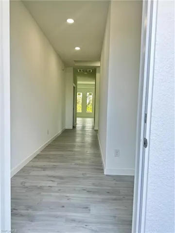 Hallway with light wood-type flooring
