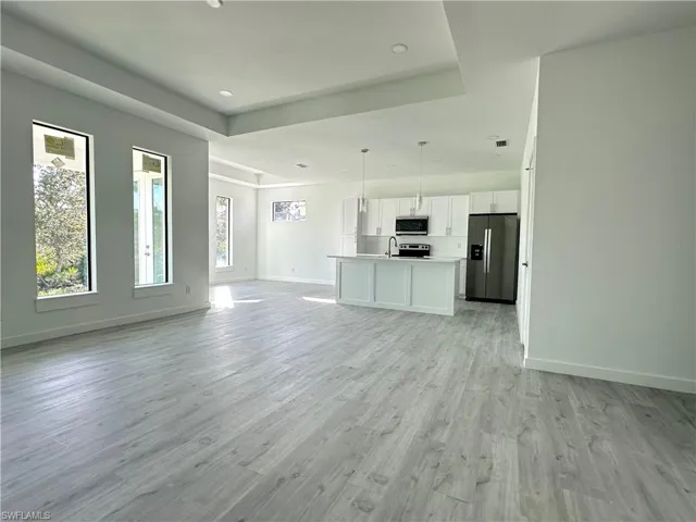 Unfurnished living room featuring light hardwood / wood-style floors