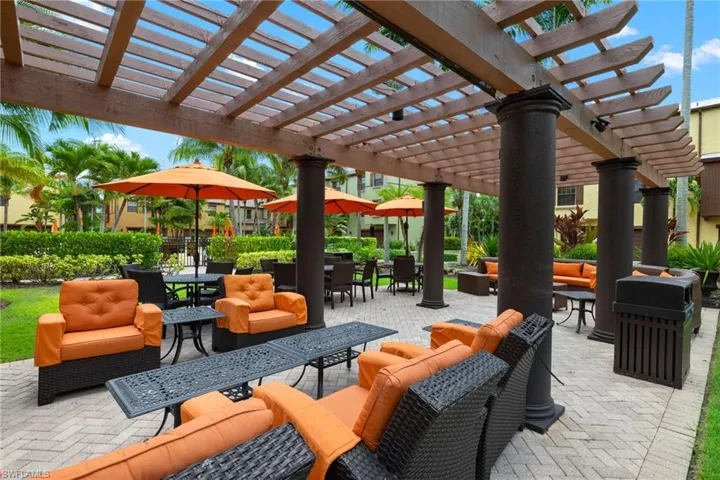 View of patio with a pergola and an outdoor hangout area