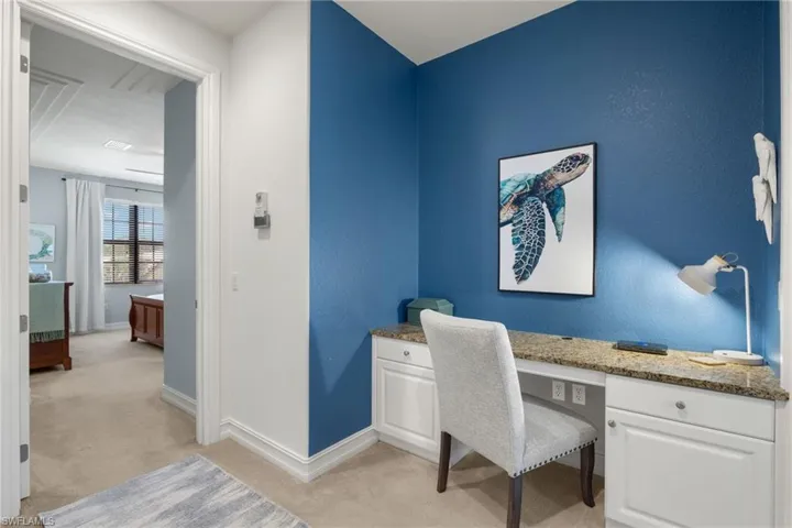 Office featuring light colored carpet