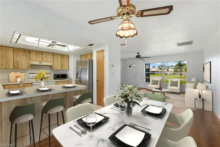 DINING AREA, BREAKFAST BAR, & LIVING ROOM VIRTUALLY STAGED