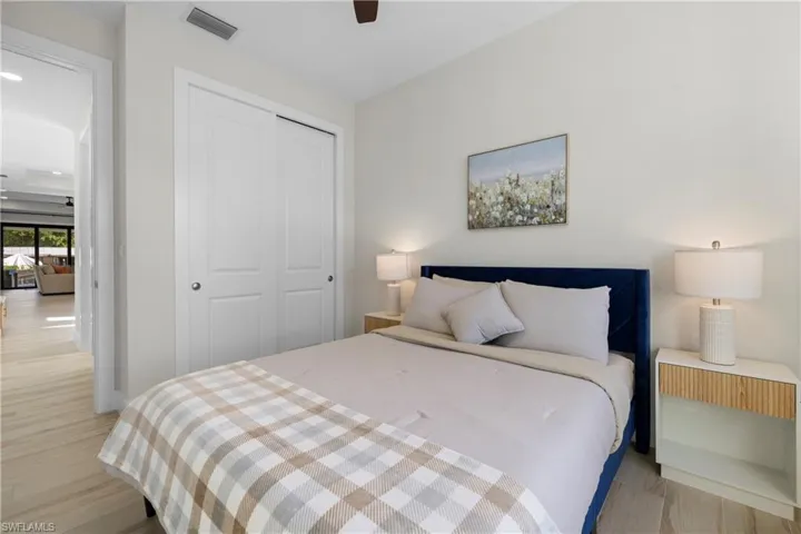 Bedroom featuring light wood-finish flooring and a ceiling fan
