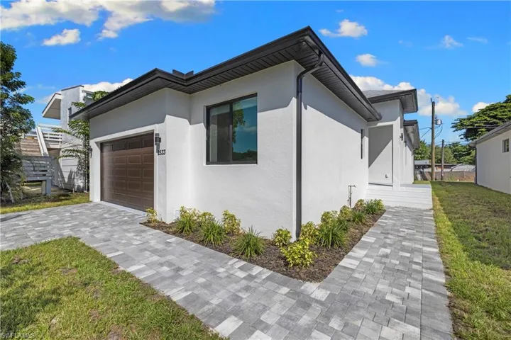 Contemporary exterior with smooth white stucco finish