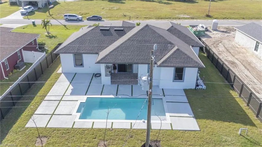 View of swimming pool featuring a yard and a patio