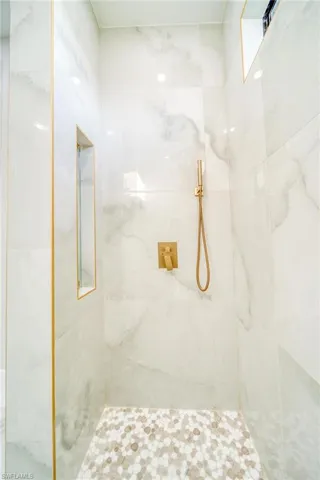 Bathroom featuring tiled shower