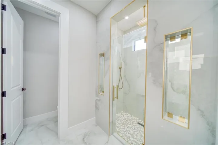 Bathroom featuring toilet and walk in shower