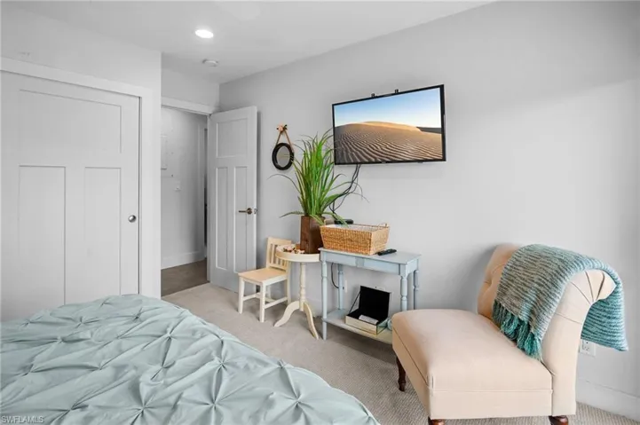 Bedroom with carpet floors, ceiling fan, and recessed lighting