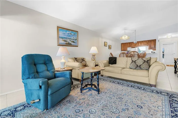 Living room with light tile floors and baseboards