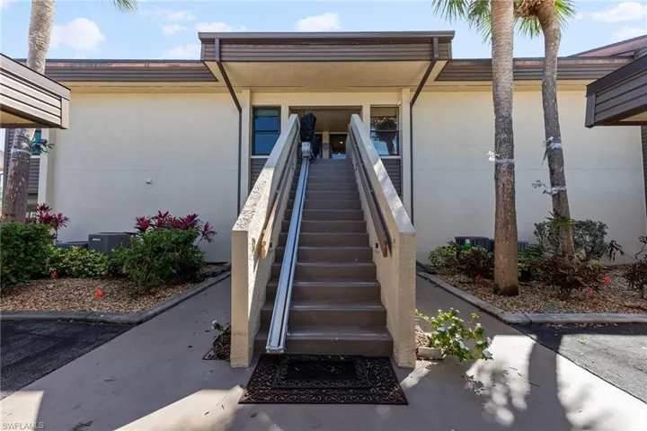 View of exterior entry with stucco siding
