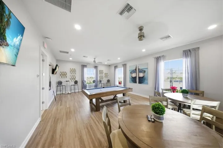 Rec room with billiards table and recessed lighting
