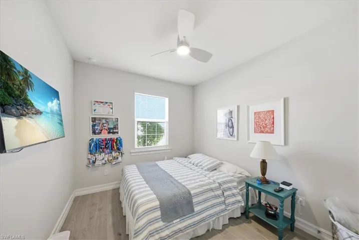 Bedroom with light wood-style flooring and ceiling fan