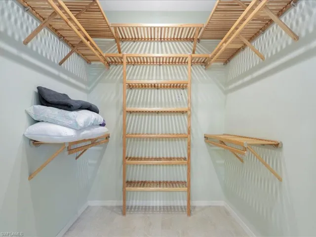 Spacious closet with carpet floors