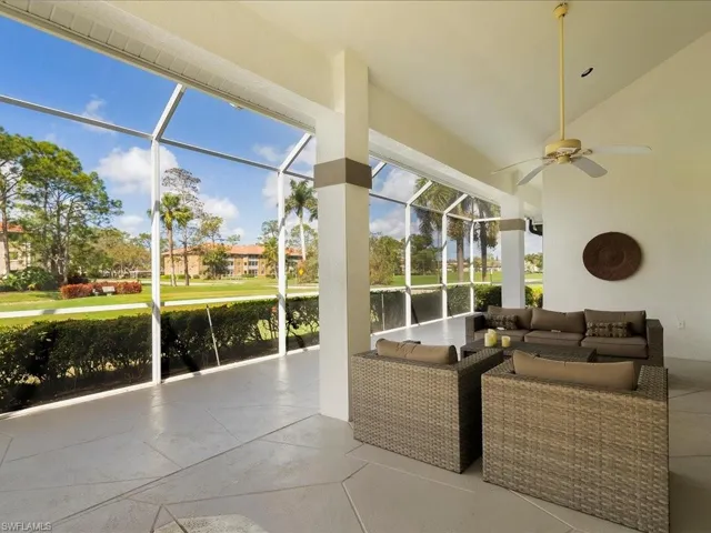 Sunroom featuring ceiling fan