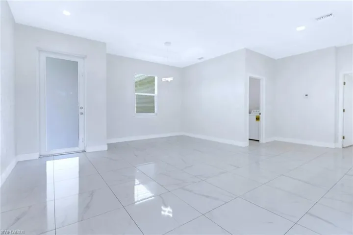 Spare room with washer / dryer and recessed lighting