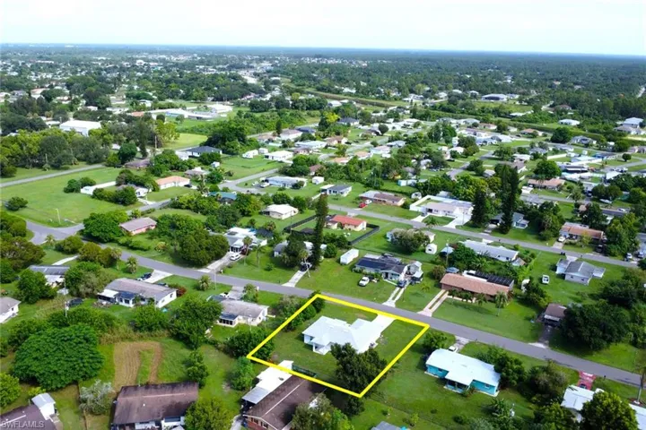 Aerial view of residential area with property boundaries highlighted