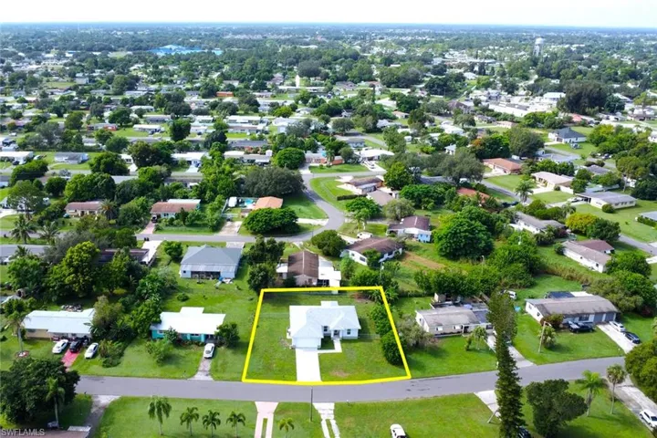 Aerial perspective of suburban area featuring property parcel outlined
