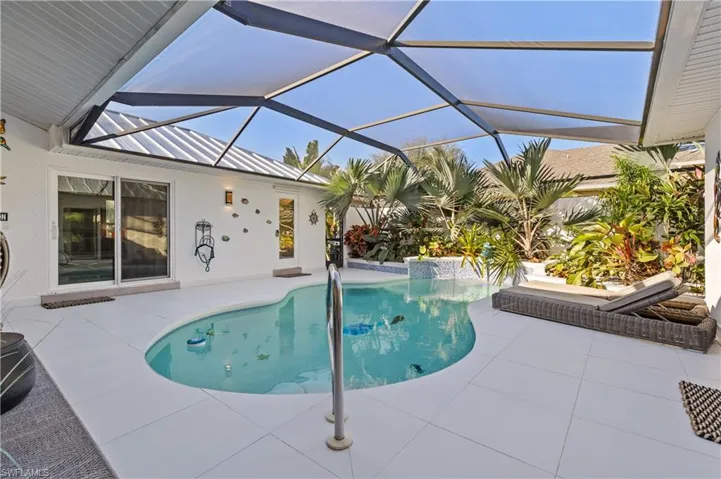 Swimming pool with a patio area,